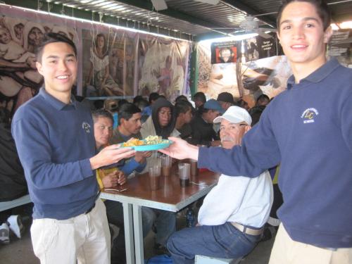 High school students help serve breakfast